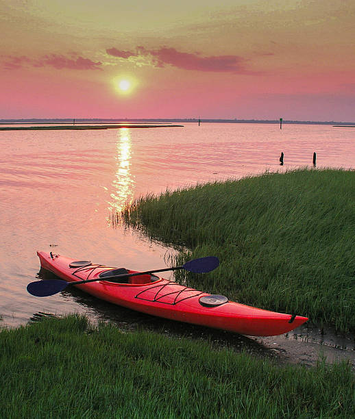 istock Red kayak at sunset/sunrise 2246952161
