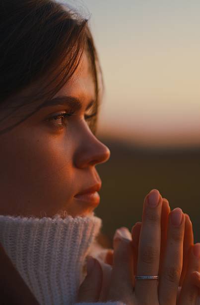 istock Close-Up Woman Face Profile and Hands Sunset Light 2246954804