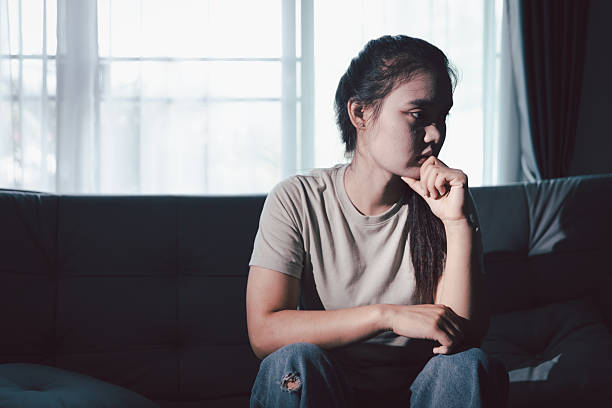 istock Sorrowful woman sat alone, overwhelmed by emotion, her sad and unhappy expression revealing deep despair, stress and distress left feeling depressed. sorrowful sad, despair alone, depressed stress 2246959602