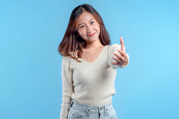istock Friendly Indonesian Woman Reaching Out 2246959908