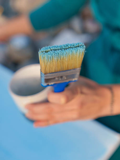 istock Artist Holding Brush with Blue Paint 2246960131
