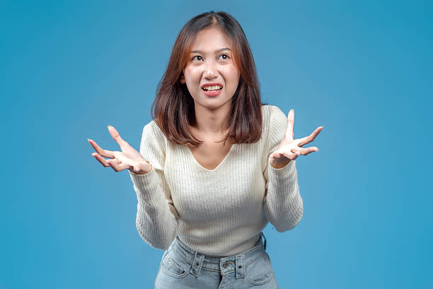 istock Indonesian Woman Showing Confused Hand Gesture 2246960935