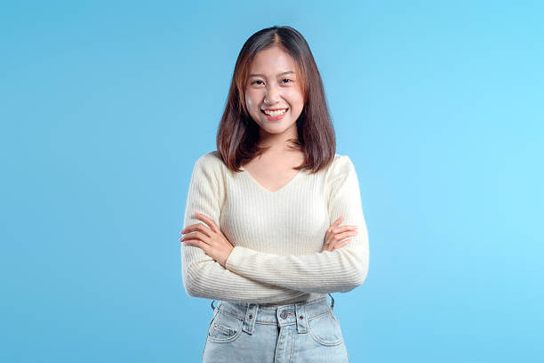 istock Confident Indonesian Woman on Blue Background 2246961465