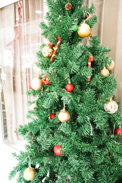 istock A Christmas tree with gold and red ornaments 2246962914