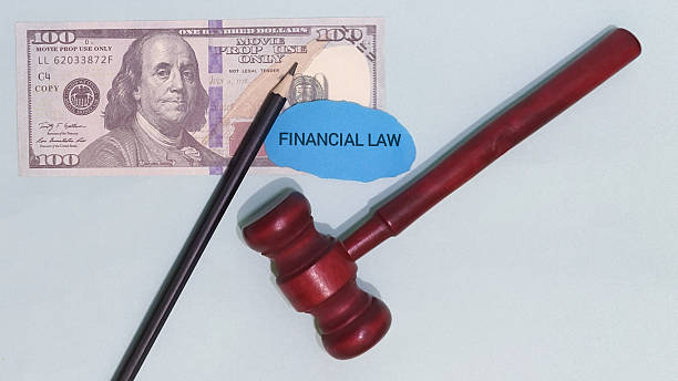istock Gavel pencil and hundred dollar bill represent financial law on a light background symbolizing legal 2246963108