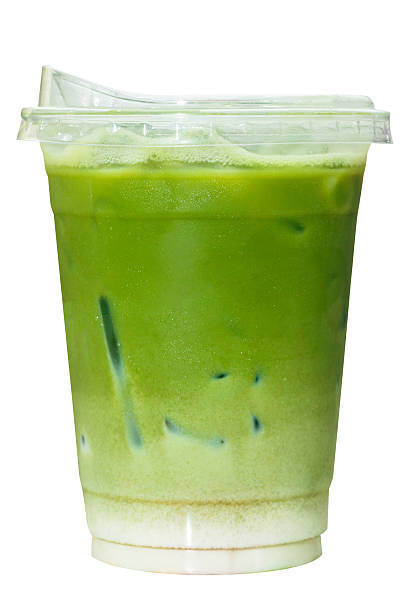 Iced Matcha green tea latte in a plastic cup, ready to drink, isolated on white background with clipping path.