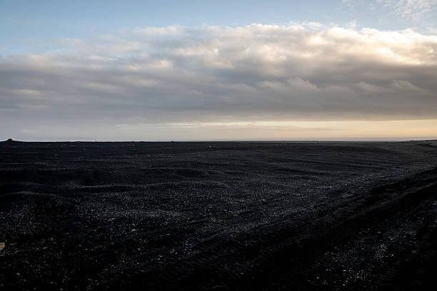 istock Dry black sand beach in Iceland at sunset. Toned. 2246966832