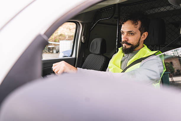 istock Delivery worker concentrated while driving a van, exhibiting responsibility and focus. 2246978618