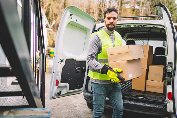 istock Delivery Personnel Loading Boxes into a Van. Attention to Detail in Logistics 2246978636