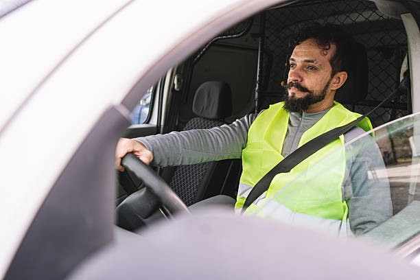 istock Delivery worker concentrated while driving a van, exhibiting responsibility and focus. 2246978659