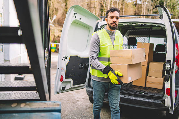 istock Delivery Personnel Loading Boxes into a Van. Attention to Detail in Logistics 2246978660