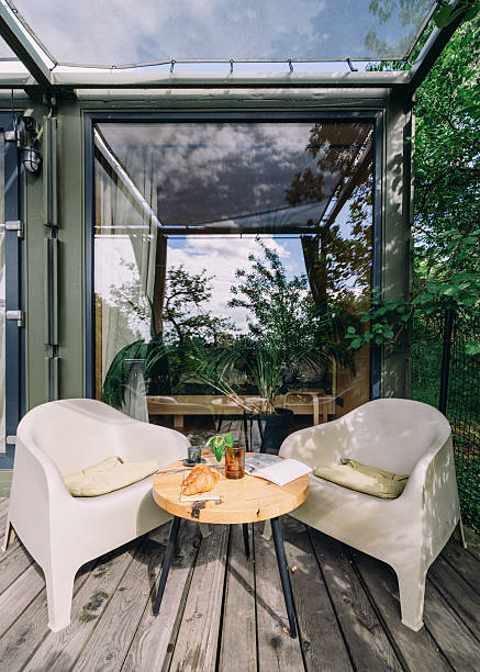 istock Cozy seating area with a refreshing drink and snacks in a natural setting 2246980038