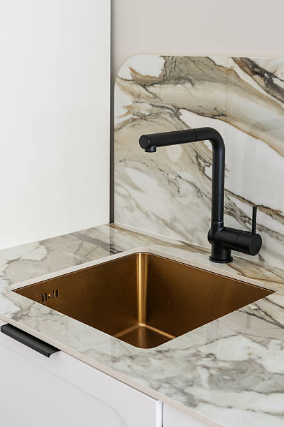 istock Modern kitchen design featuring sleek marble countertop and stylish sink 2246980428