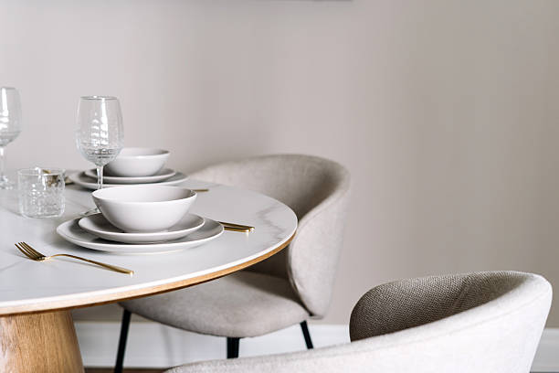 istock A beautifully arranged dining table features white dishes and elegant cutlery 2246980493