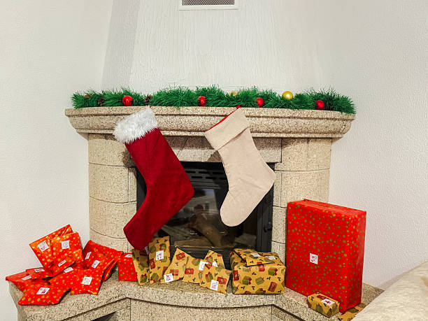 Fireplace decorated with Christmas stockings and presents