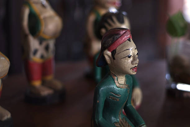 istock Traditional Wooden Characters Arranged in Warm, Intimate Setting 2246984424