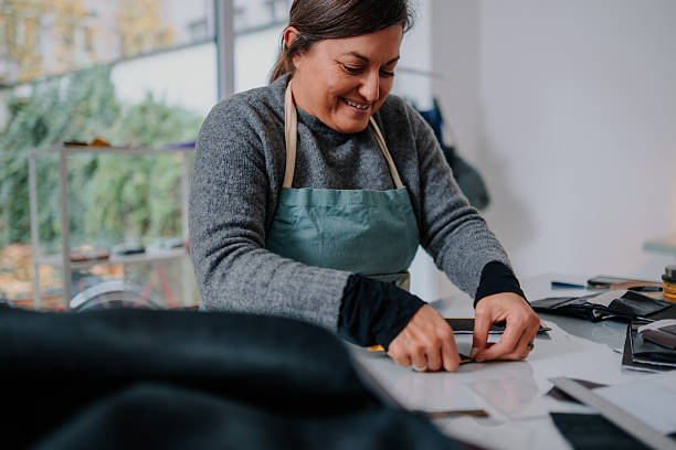 istock Woman artisan crafting leather product in workshop 2246985130