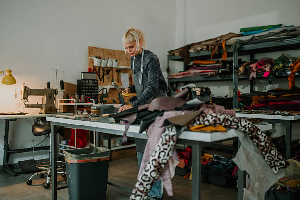 istock Woman artisan crafting leather goods in workshop 2246985663