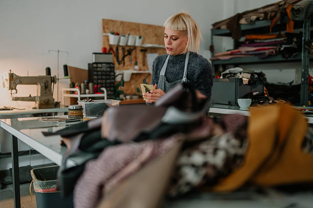 istock Woman artisan crafting leather goods in workshop 2246985664