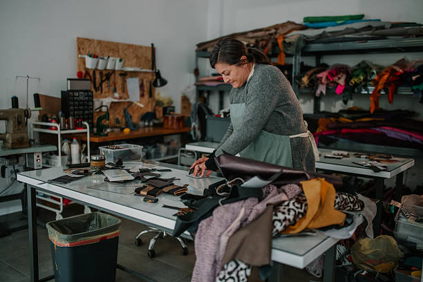 istock Woman artisan crafting leather product in workshop 2246985752