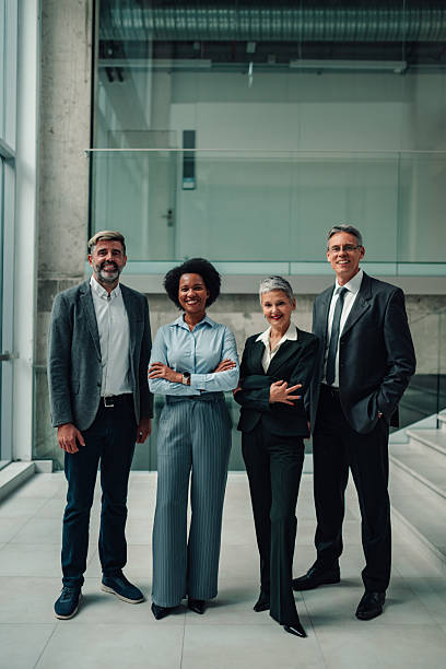 istock Diverse business team smiling in modern office building 2246988895