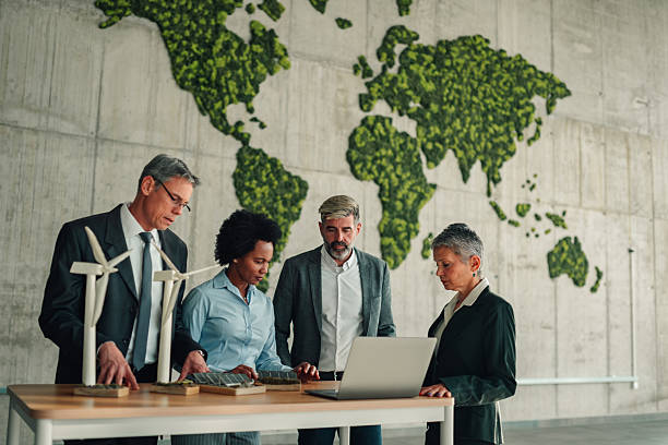 istock Business people discussing renewable energy sustainability strategy 2246989216