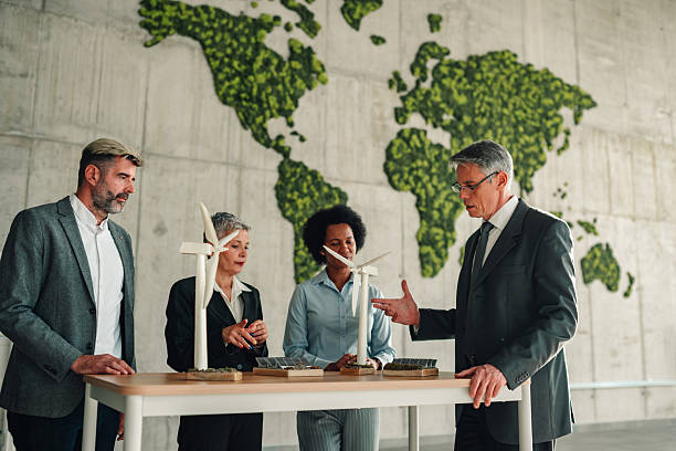 istock Business team discussing renewable energy solutions in office 2246989266