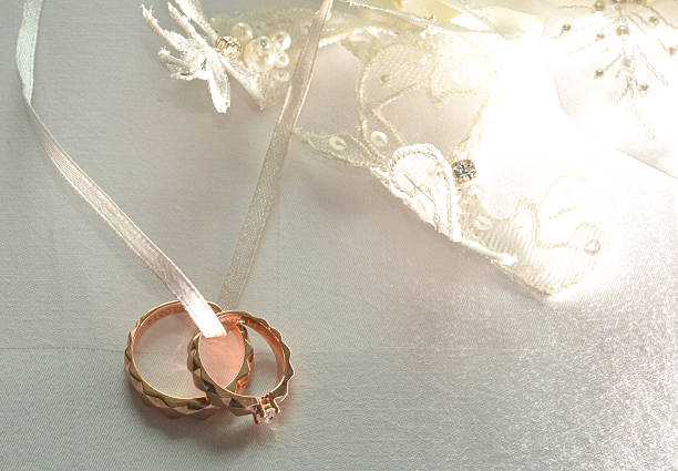 Elegant precious Diamond wedding Rings Resting On Surface With Blurred Backdrop For Wedding ceremony