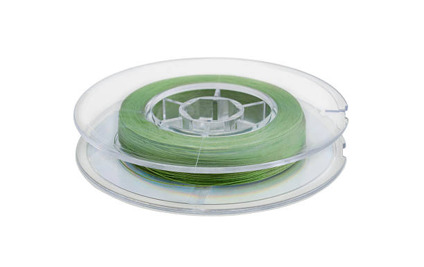 istock Fishing line on a plastic reel isolated on white. 2246990490
