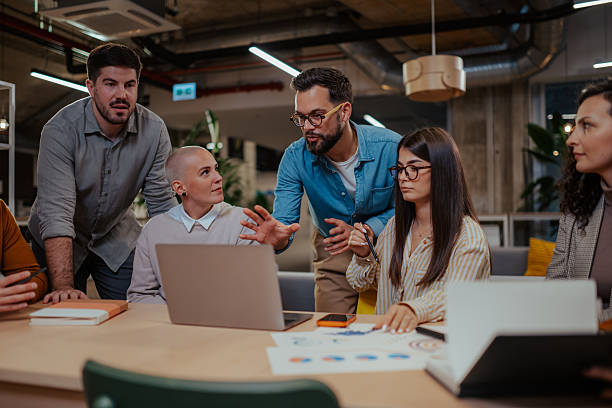 istock Business team collaborating on project in modern office 2246991737