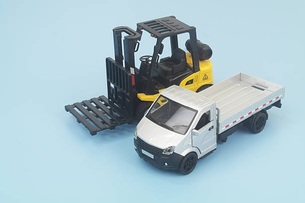 istock Lorry and forklift trucks on blue background. 2246991963