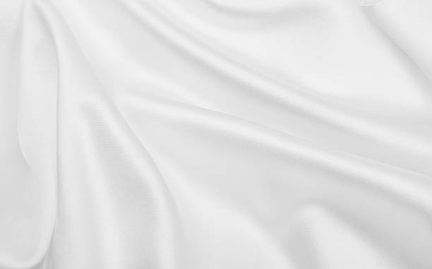 istock Smooth elegant white silk or satin luxury cloth texture as wedding background. Luxurious Christmas background or New Year background design 2246992663