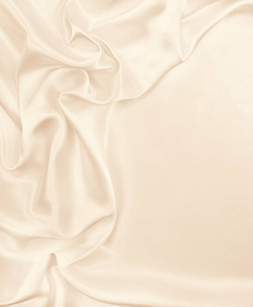 istock Smooth elegant golden silk or satin luxury cloth texture as wedding background. Luxurious Christmas background or New Year background design. In Sepia toned. Retro style 2246992688