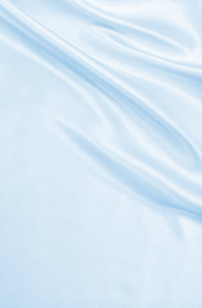 istock Smooth elegant blue silk or satin luxury cloth texture as abstract background. Luxurious Christmas background or New Year background design 2246992786