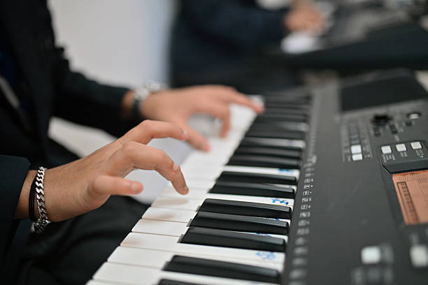 Montreal, Canada - July 26, 2014: Homeless man playing a piano on a street in Montreal, Quebec, Canada.