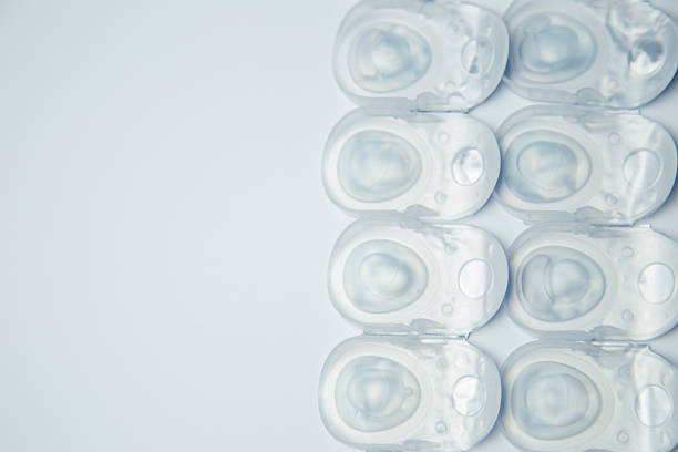 istock Several rows of daily contact lenses in a disposable protective case lie on the side on a white background with space for text. The concept of ophthalmology, vision correction, eye care. 2246995013