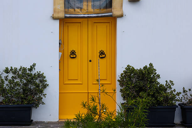 istock Vibrant Yellow Door with Mediterranean Charm 2246999465