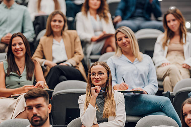 istock Audience members attending business conference lecture 2247000750