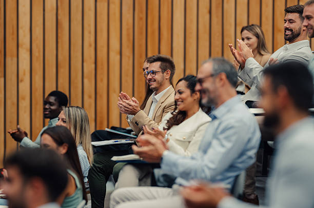 istock Business professionals applauding during a conference presentation 2247002489