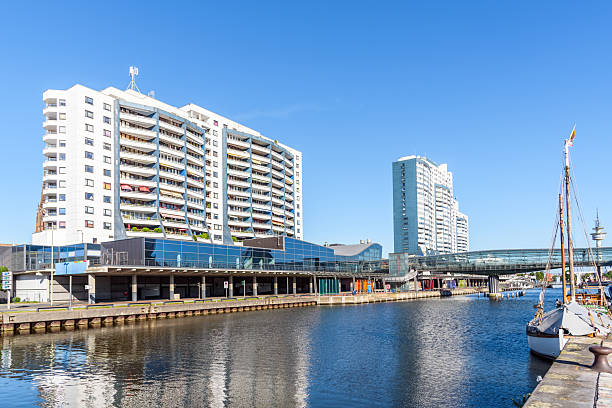 istock Towering harbourside apartment blocks under clear blue sky in summer 2247002689