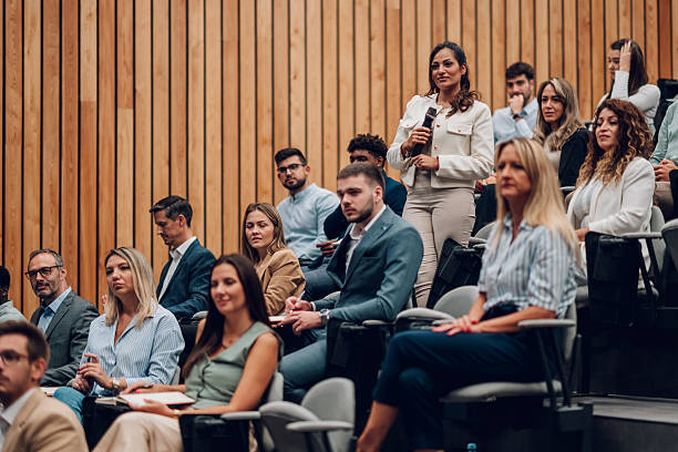 istock Woman asking question during business conference seminar 2247002770