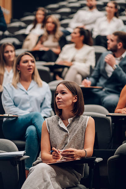 istock Young woman learning at business conference seminar 2247002778