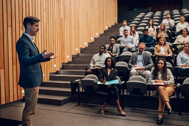 istock Speaker presenting to a diverse audience at a business conference 2247002870