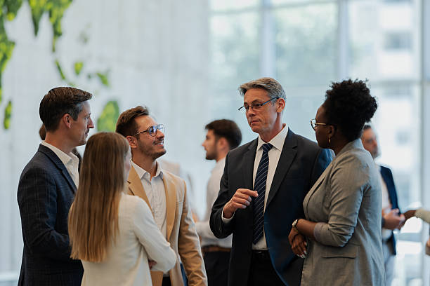 istock Business professionals networking at corporate conference 2247004400