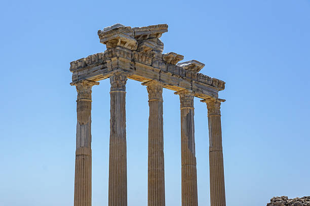 istock An ancient structure Apollon Temple in the form of many pillars and an arch embedded in the side of Turkey In the background is the blue Mediterranean Sea. The sky is bright and blue 2247006206