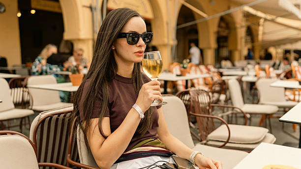 istock Woman Enjoying Wine in Pleasant Setting 2247009188