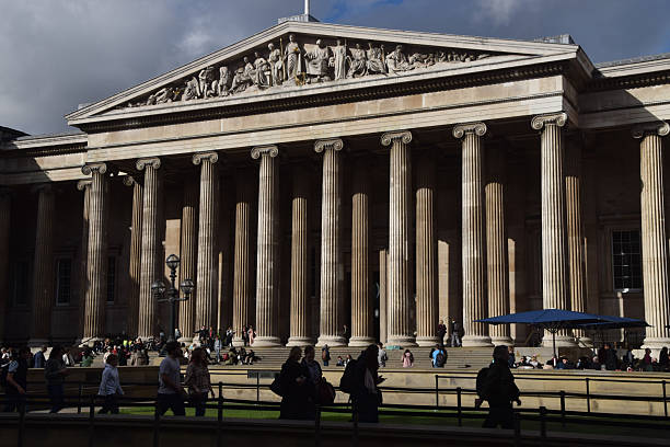 London, UK - October 22 2025: exterior view of the British Museum with people walking outside.