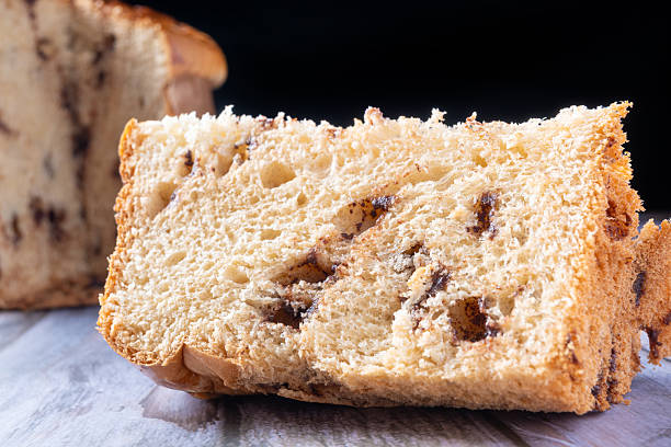 istock Panettone with chocolate chips, a beautiful and delicious panettone with real chocolate chips on a rustic table, Selective Focus. 2247018481