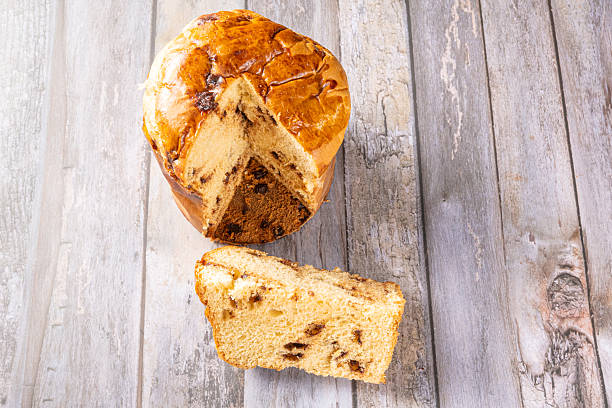 istock Panettone with chocolate chips, a beautiful and delicious panettone with real chocolate chips on a rustic table, Selective Focus. 2247018504