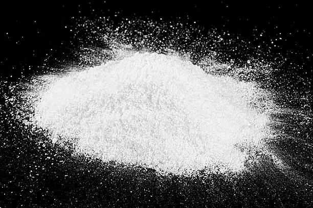 istock Snowball splat on a black wall. White fluffy snow. Christmas. 2247021581